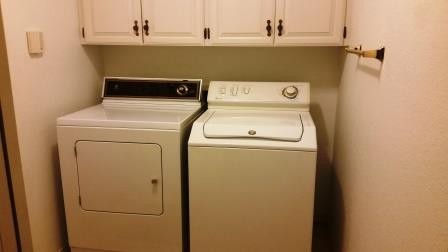 laundry room with washer and dryer included