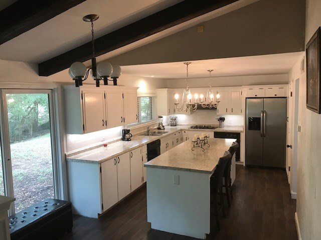 kitchen with large island and new appliances