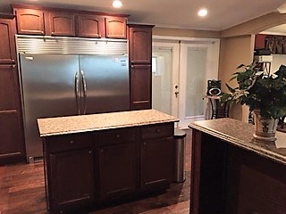 large kitchen island, stainless steel appliances, extra large refrigerator/freezer